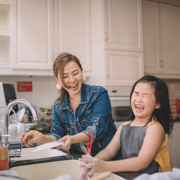 The Power of Questions 4 girl washing dishes with mother